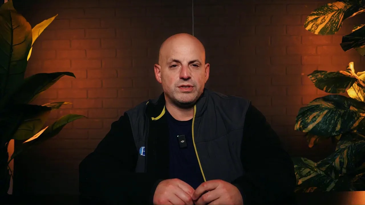 Clear studio shot of the presenter centered in frame, warm lighting and plants, speaking about next steps for SBA 504 green loans.